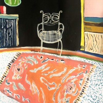 White Chair with Orange Rug